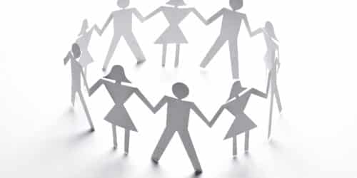 close up of paper people couple on white background